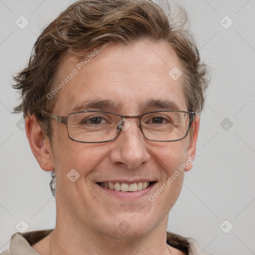 Joyful white adult male with short  brown hair and grey eyes