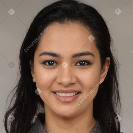 Joyful latino young-adult female with long  brown hair and brown eyes