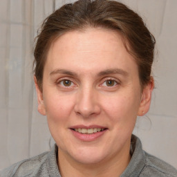 Joyful white adult female with short  brown hair and grey eyes