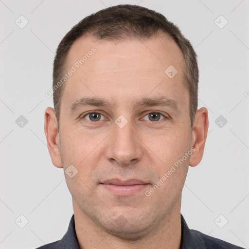 Joyful white adult male with short  brown hair and brown eyes