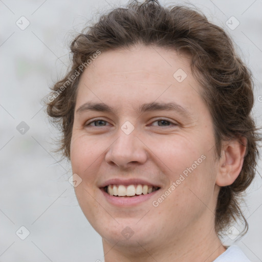 Joyful white young-adult female with medium  brown hair and green eyes