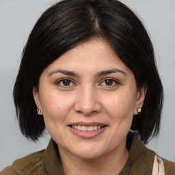 Joyful white adult female with medium  brown hair and brown eyes