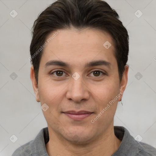 Joyful white adult male with short  brown hair and brown eyes