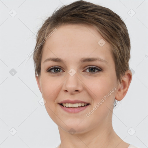 Joyful white young-adult female with short  brown hair and grey eyes