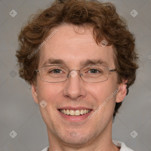 Joyful white adult male with short  brown hair and grey eyes