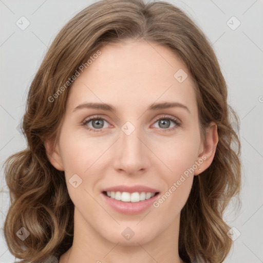 Joyful white young-adult female with medium  brown hair and green eyes