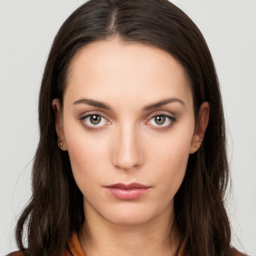 Neutral white young-adult female with long  brown hair and brown eyes