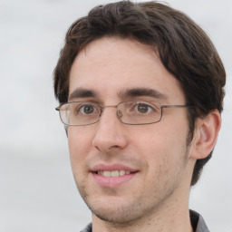 Joyful white adult male with short  brown hair and grey eyes