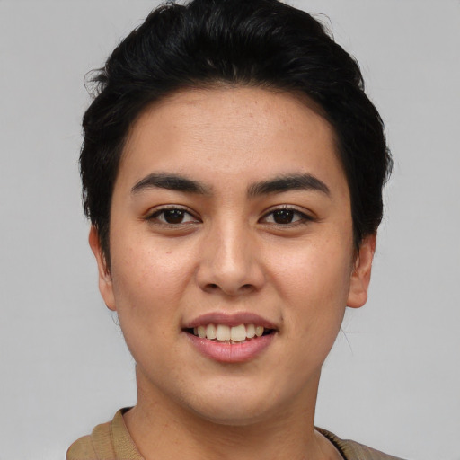 Joyful asian young-adult female with short  black hair and brown eyes