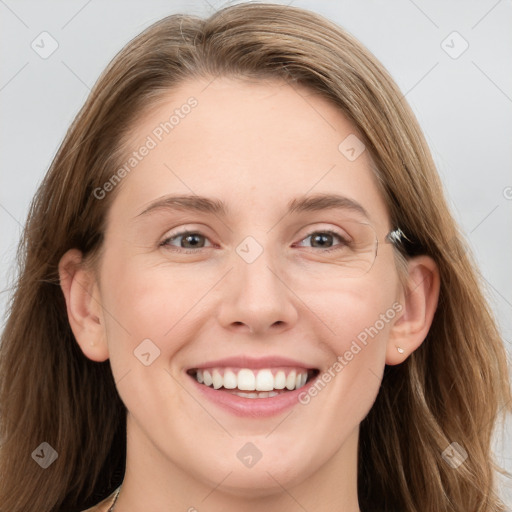 Joyful white young-adult female with long  brown hair and grey eyes