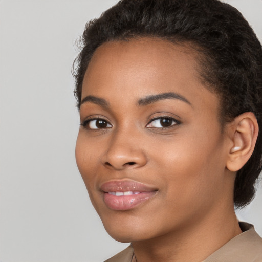 Joyful latino young-adult female with short  black hair and brown eyes