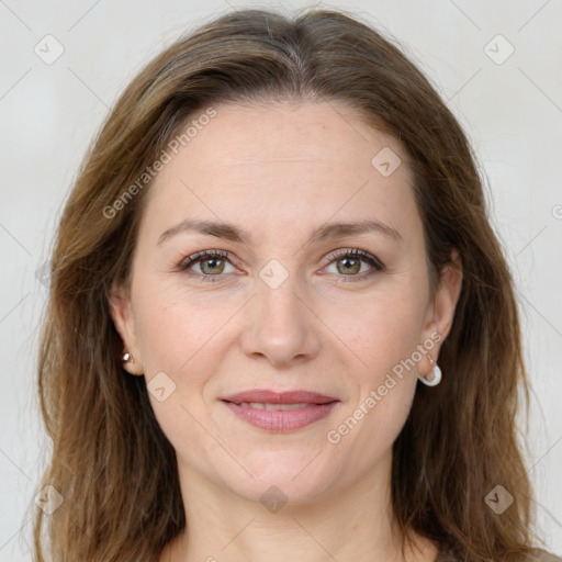 Joyful white adult female with long  brown hair and brown eyes