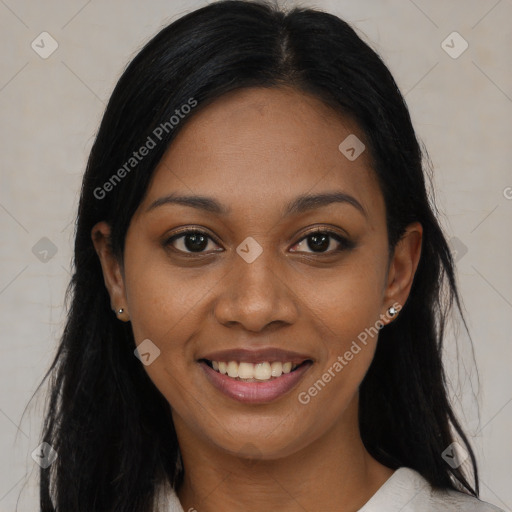 Joyful black young-adult female with long  black hair and brown eyes