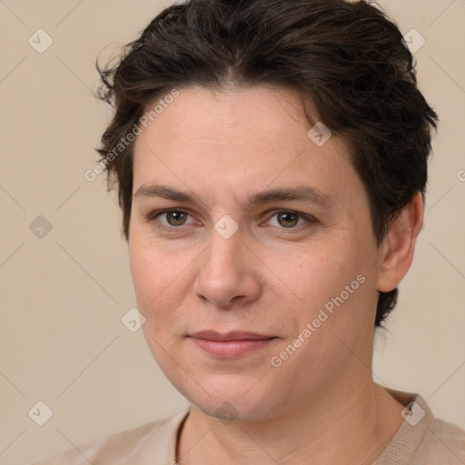 Joyful white adult female with short  brown hair and brown eyes