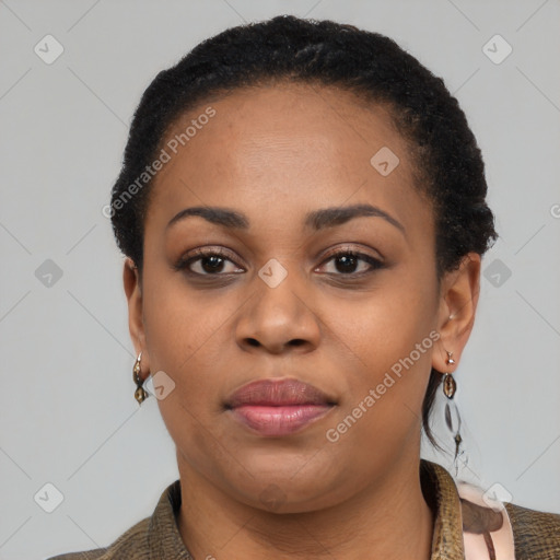 Joyful black young-adult female with short  black hair and brown eyes
