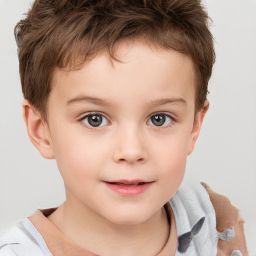 Joyful white child male with short  brown hair and brown eyes