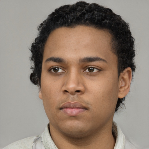 Neutral black young-adult male with short  black hair and brown eyes