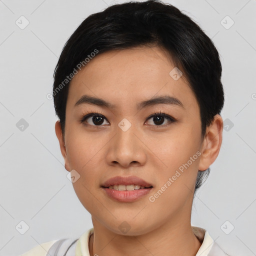 Joyful asian young-adult female with short  black hair and brown eyes