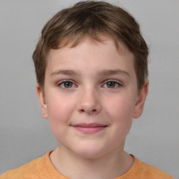 Joyful white child female with short  brown hair and brown eyes