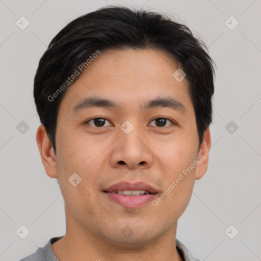 Joyful asian young-adult male with short  brown hair and brown eyes