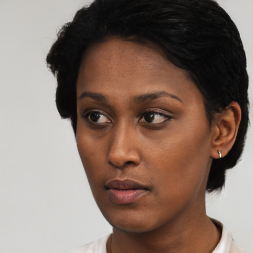 Neutral black young-adult female with short  black hair and brown eyes