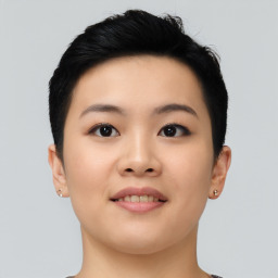 Joyful asian young-adult female with short  black hair and brown eyes