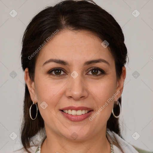 Joyful white adult female with medium  brown hair and brown eyes