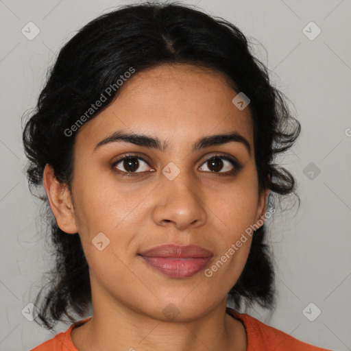 Joyful latino young-adult female with medium  brown hair and brown eyes