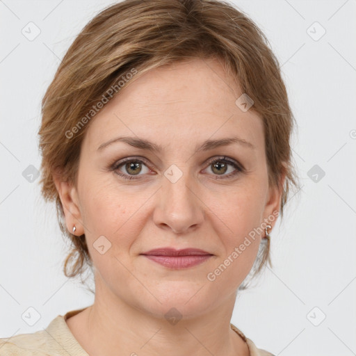 Joyful white adult female with medium  brown hair and grey eyes