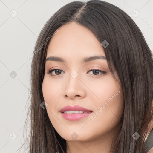 Joyful white young-adult female with long  black hair and brown eyes