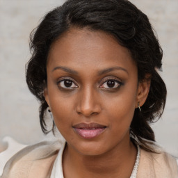 Joyful black young-adult female with medium  brown hair and brown eyes