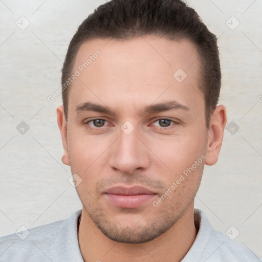 Neutral white young-adult male with short  brown hair and brown eyes