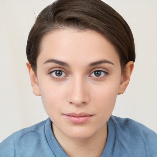 Neutral white young-adult female with short  brown hair and brown eyes