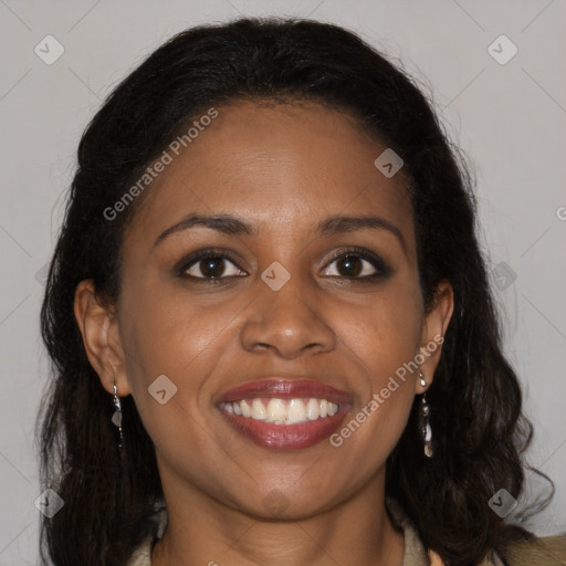 Joyful black young-adult female with long  brown hair and brown eyes