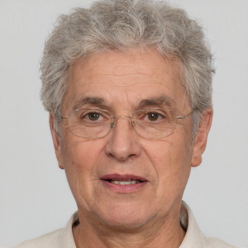 Joyful white middle-aged male with short  gray hair and brown eyes