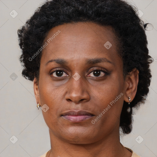 Neutral black adult female with short  black hair and brown eyes