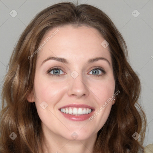 Joyful white young-adult female with long  brown hair and green eyes