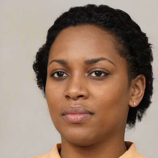 Neutral black young-adult female with short  black hair and brown eyes