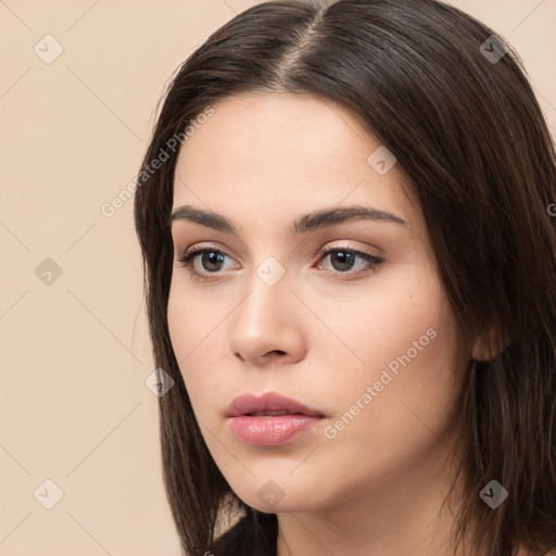 Neutral white young-adult female with long  brown hair and brown eyes