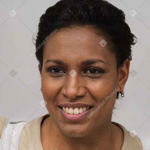 Joyful latino young-adult female with short  brown hair and brown eyes