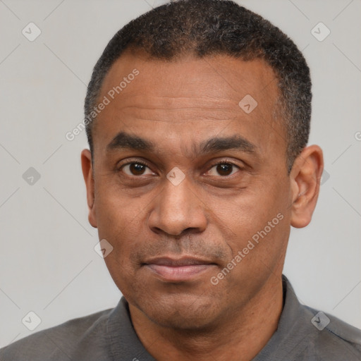 Neutral latino adult male with short  black hair and brown eyes
