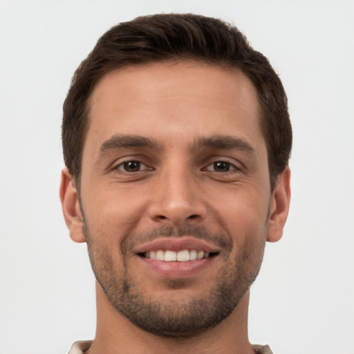 Joyful white young-adult male with short  brown hair and brown eyes