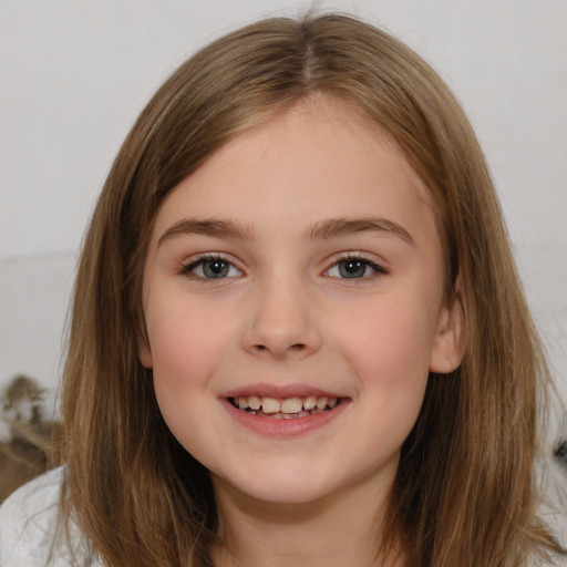 Joyful white child female with medium  brown hair and brown eyes