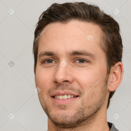 Joyful white young-adult male with short  brown hair and brown eyes