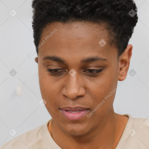 Joyful black young-adult female with short  black hair and brown eyes
