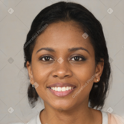 Joyful black young-adult female with medium  black hair and brown eyes