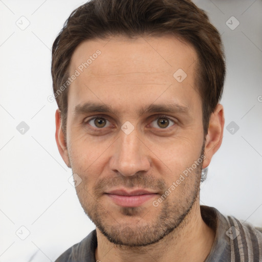 Joyful white adult male with short  brown hair and brown eyes