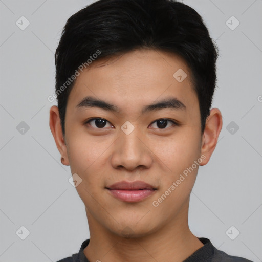 Joyful asian young-adult male with short  black hair and brown eyes