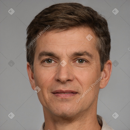 Joyful white adult male with short  brown hair and brown eyes