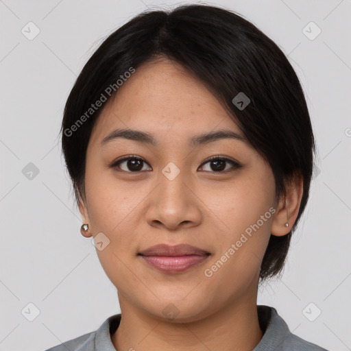 Joyful asian young-adult female with medium  black hair and brown eyes